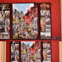 a group of pictures on a wall in a room